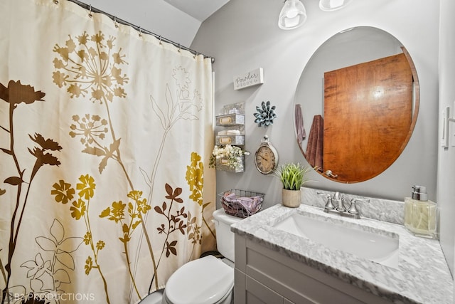 bathroom with vanity, toilet, and a shower with shower curtain