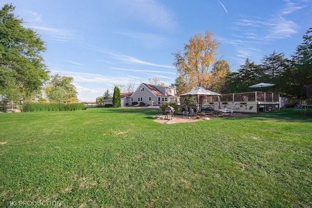 view of yard with a gazebo, a deck, and a patio