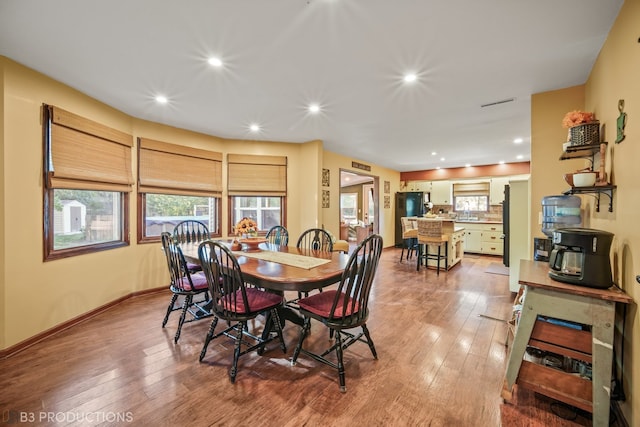 dining area with hardwood / wood-style flooring