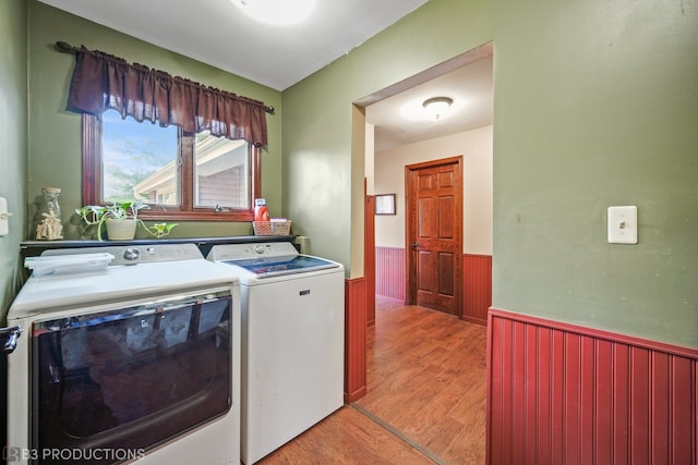 laundry area featuring washer and dryer and light wood-type flooring