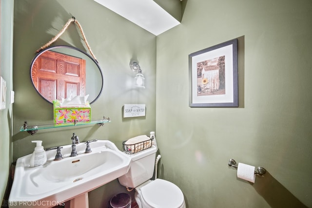 bathroom with sink and toilet