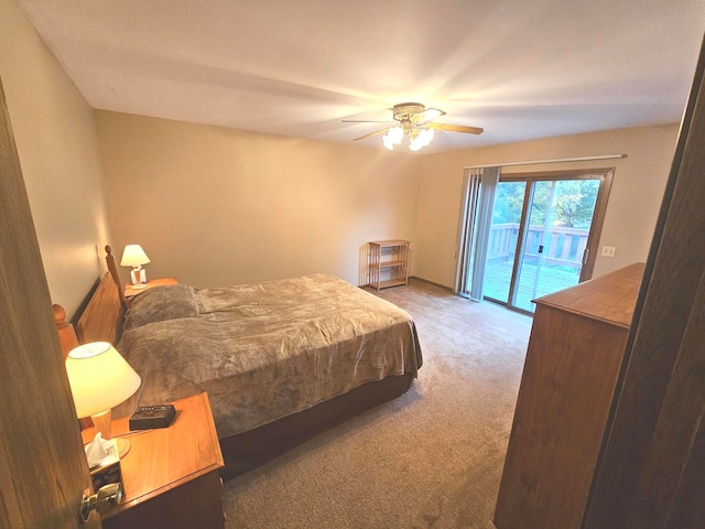 carpeted bedroom featuring ceiling fan and access to outside