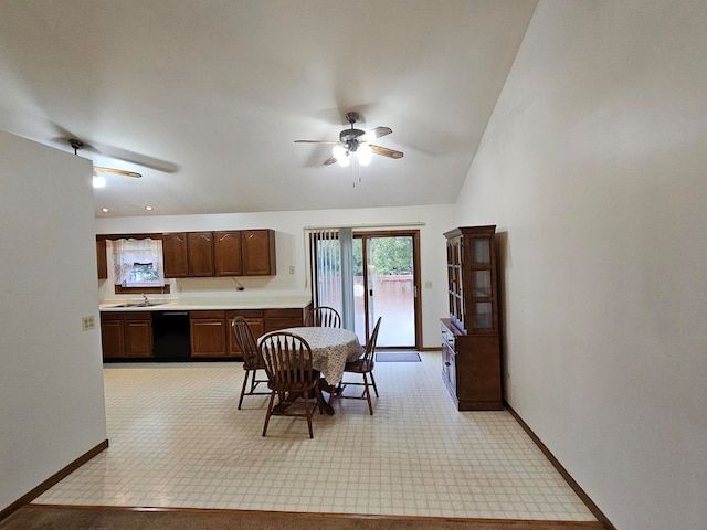 dining space with ceiling fan, sink, and light colored carpet