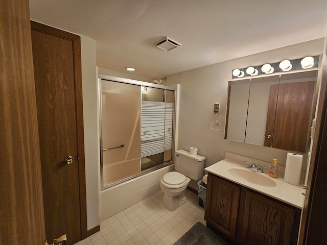 full bathroom with vanity, combined bath / shower with glass door, toilet, and tile patterned flooring