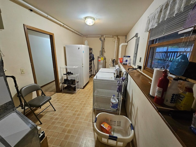 interior space featuring white fridge and water heater