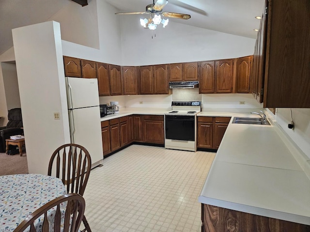 kitchen with dark brown cabinets, high vaulted ceiling, sink, and white appliances