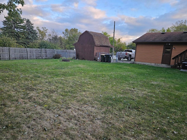 yard at dusk with an outdoor structure