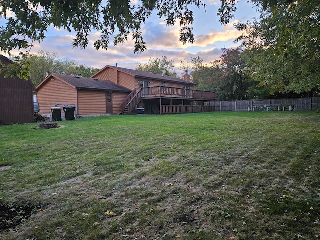 yard at dusk with a deck