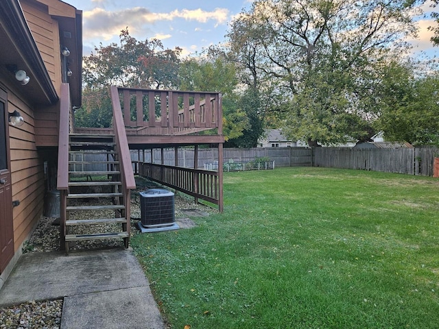 yard at dusk with central air condition unit