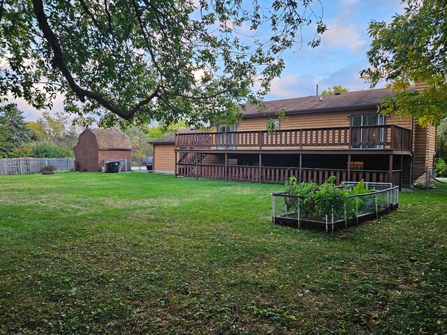 view of yard with a deck and a shed