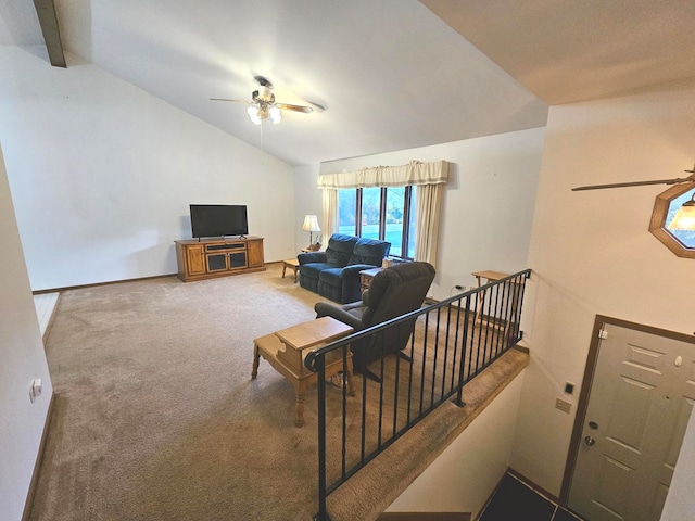 living room with lofted ceiling with beams, carpet flooring, and ceiling fan