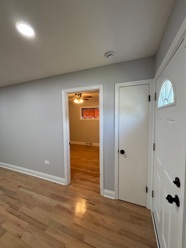 entrance foyer with ceiling fan and light wood-type flooring