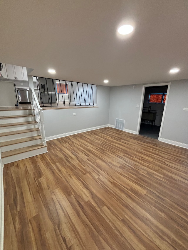 basement featuring wood-type flooring