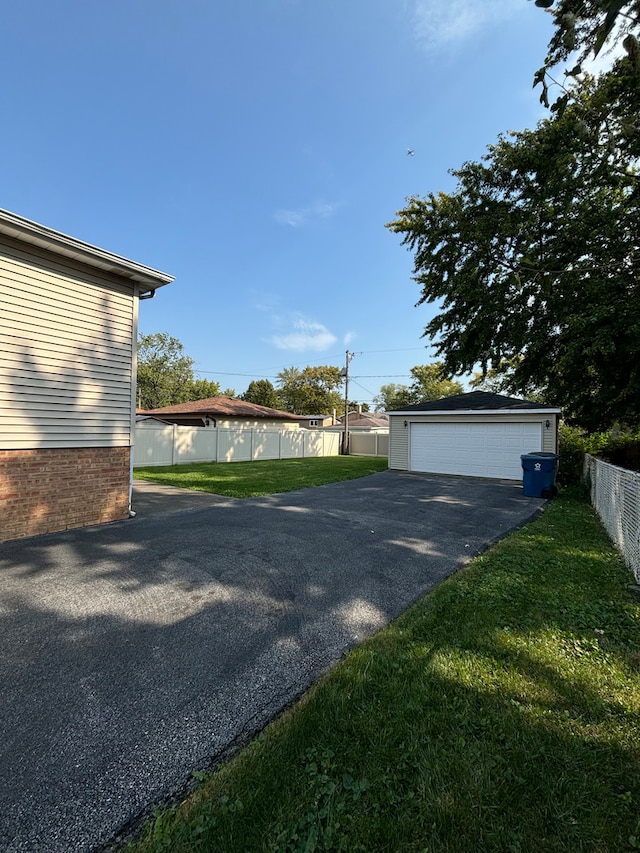 garage featuring a lawn