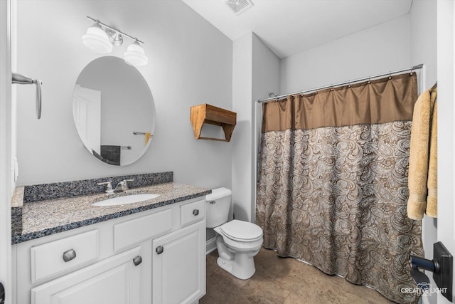 bathroom featuring curtained shower, vanity, and toilet