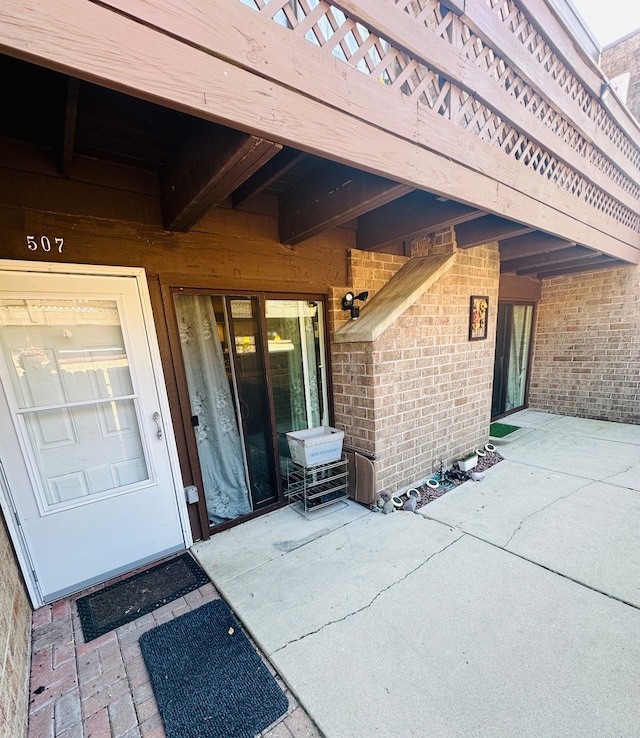 entrance to property with a patio area