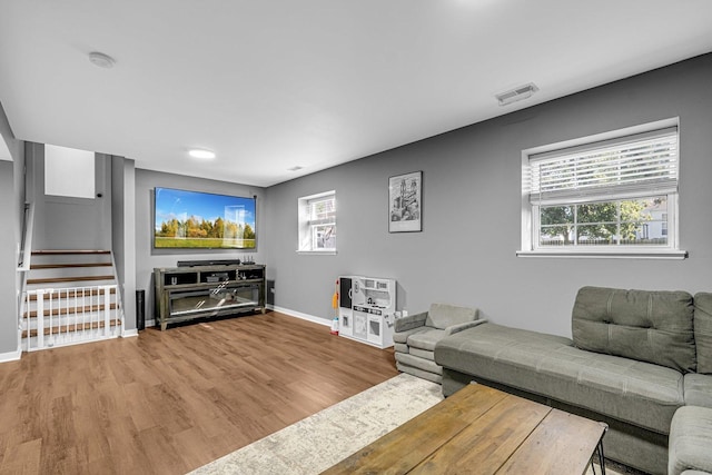 4661 W Tulip Ave, Monee, IL 60449 - living area with baseboards, wood finished floors, stairs, and healthy amount of natural light