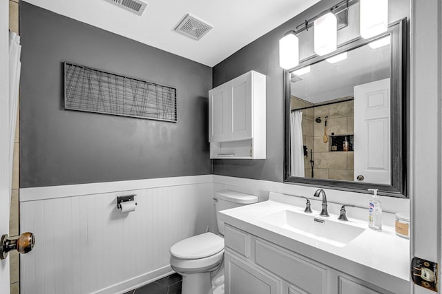 4661 W Tulip Ave, Monee, IL 60449 - bathroom with wainscoting, toilet, vanity, curtained shower, and tile patterned flooring