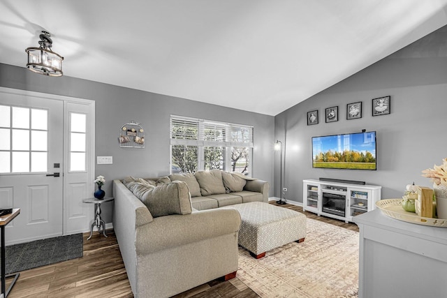 4661 W Tulip Ave, Monee, IL 60449 - living area featuring lofted ceiling, wood finished floors, and baseboards