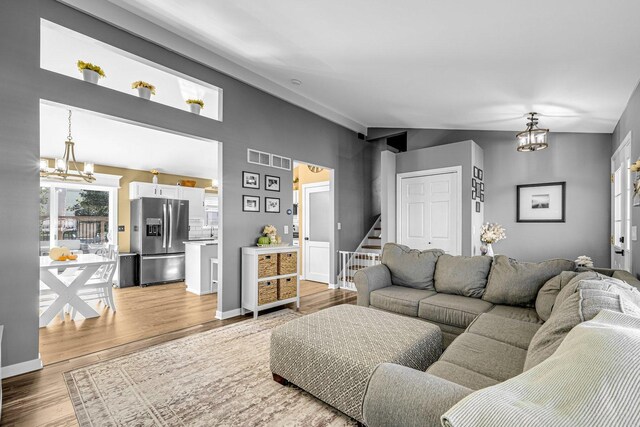 4661 W Tulip Ave, Monee, IL 60449 - living area featuring a chandelier, wood finished floors, stairway, and baseboards