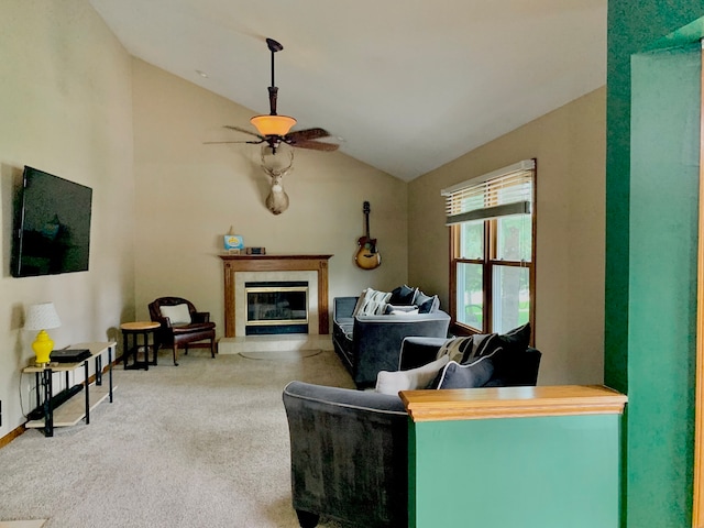 living room with ceiling fan, vaulted ceiling, and carpet flooring