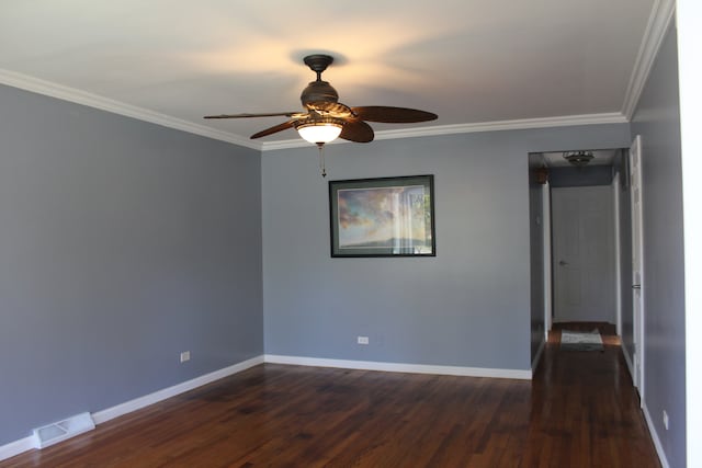 spare room with ceiling fan, crown molding, and dark wood-type flooring