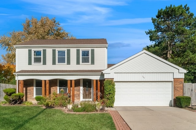 view of front of house with a porch, a garage, and a front yard