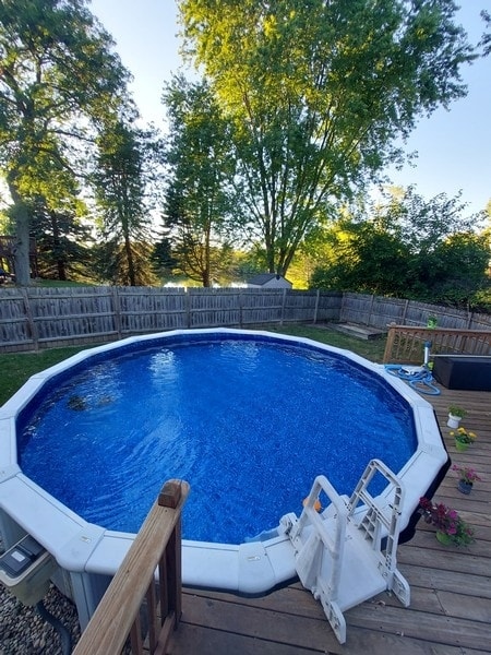 view of swimming pool with a wooden deck