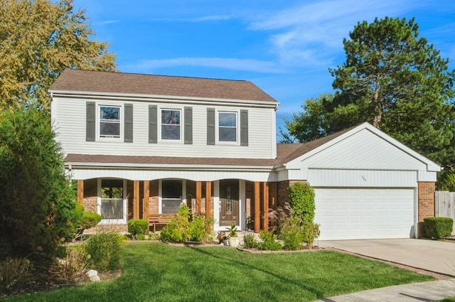 view of front facade with covered porch, a garage, and a front lawn