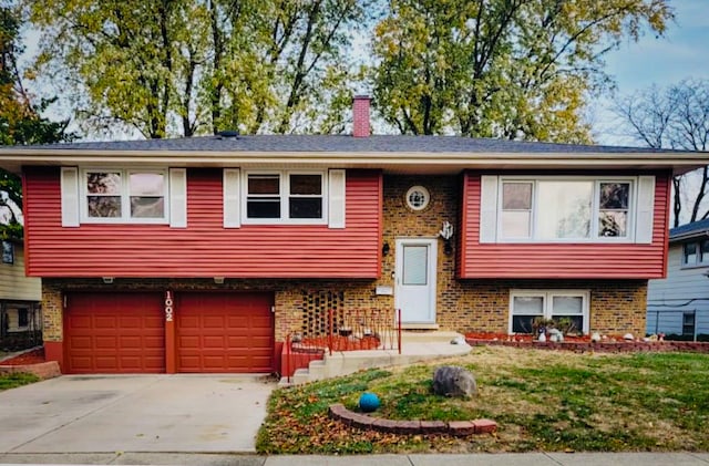 bi-level home featuring a garage