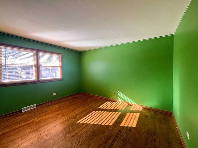 empty room featuring hardwood / wood-style floors