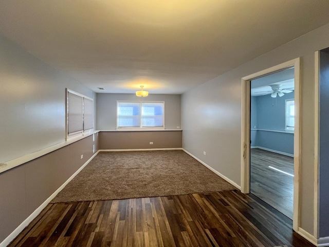 unfurnished room with dark hardwood / wood-style floors