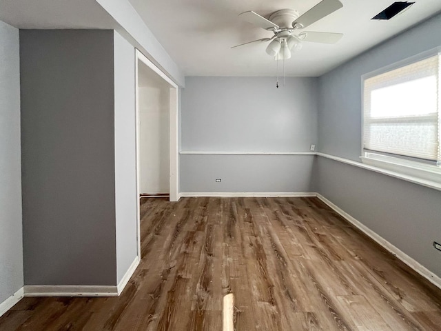 unfurnished room featuring hardwood / wood-style flooring and ceiling fan