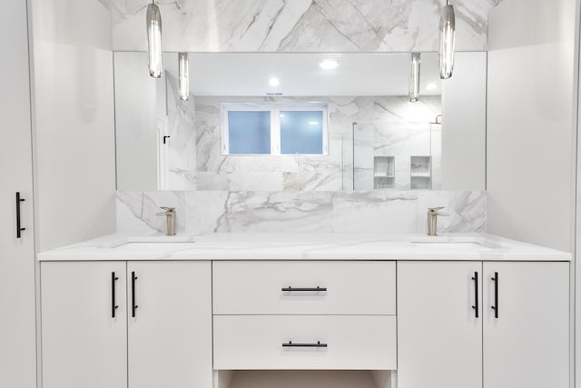 bathroom featuring vanity and a shower with door