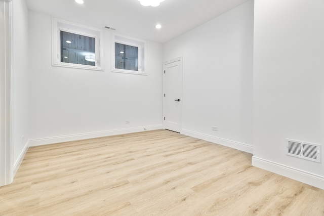 spare room featuring light hardwood / wood-style floors