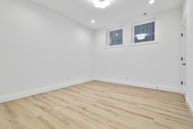 unfurnished room with light hardwood / wood-style flooring