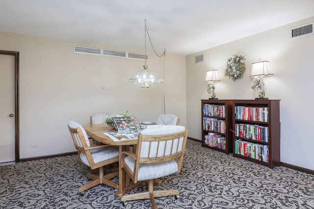 dining space featuring an inviting chandelier