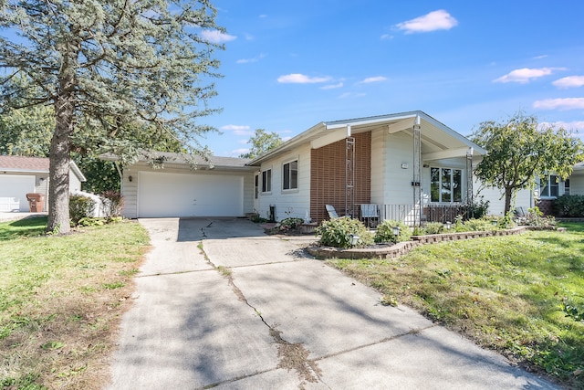 ranch-style home featuring a garage and a front lawn