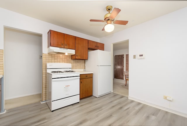 kitchen featuring ceiling fan, backsplash, light hardwood / wood-style floors, and white appliances