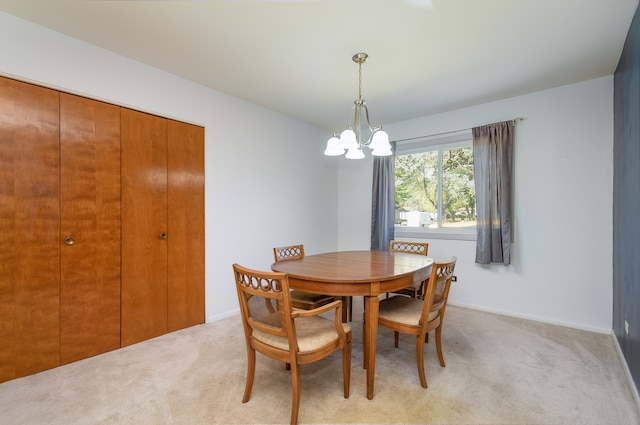 carpeted dining room with a notable chandelier