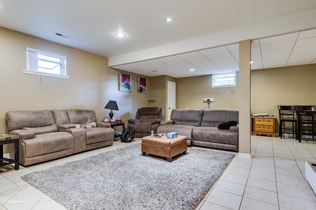 living room with tile patterned flooring and a wealth of natural light