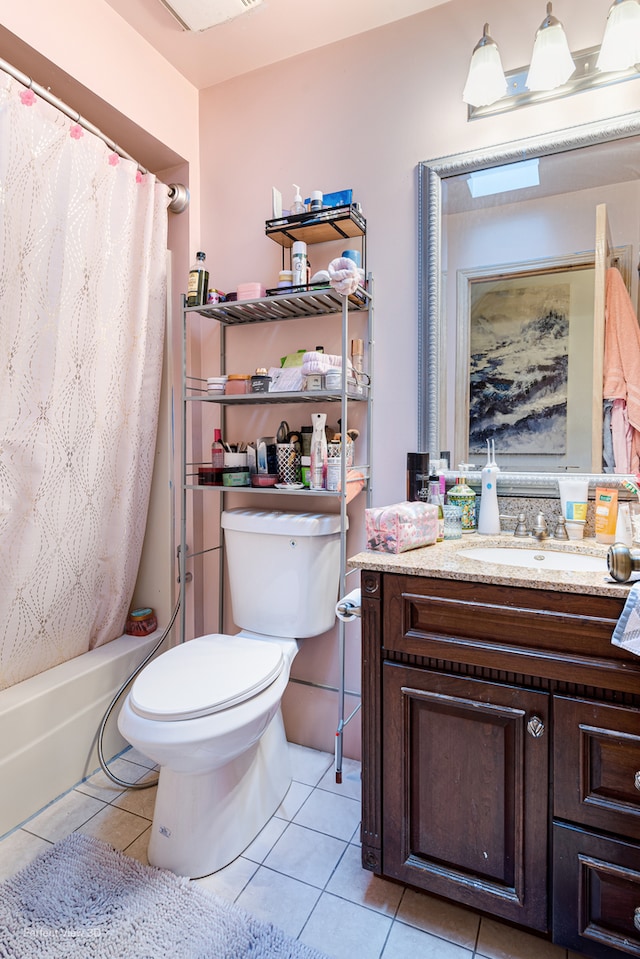 full bathroom featuring vanity, shower / tub combo, toilet, and tile patterned floors