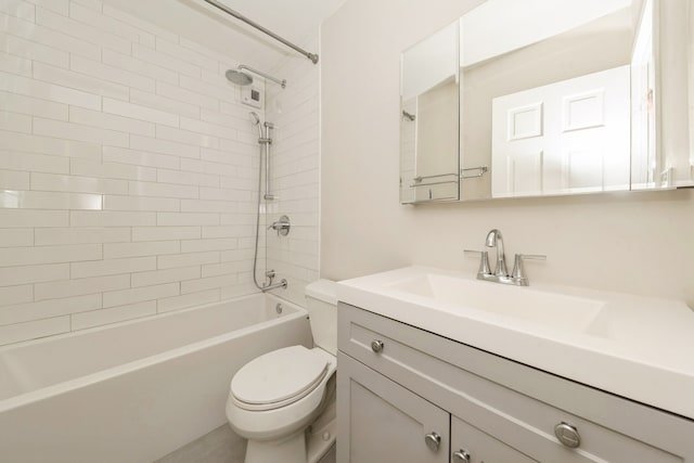 full bathroom with vanity, toilet, and tiled shower / bath