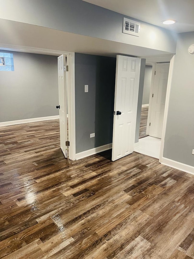 1409 E 90th St, Chicago, IL 60619 - basement with dark wood-type flooring, visible vents, and baseboards