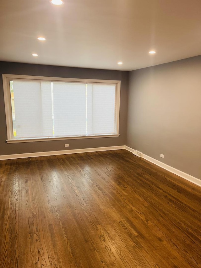1409 E 90th St, Chicago, IL 60619 - spare room with baseboards, recessed lighting, and dark wood-type flooring