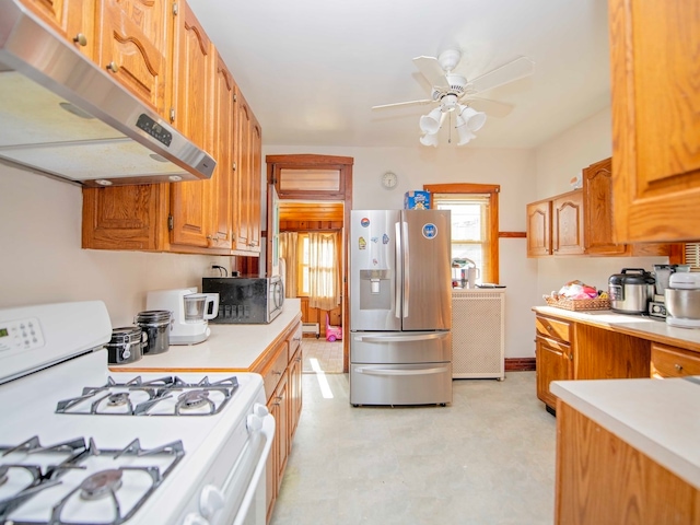 kitchen featuring ceiling fan and stainless steel appliances