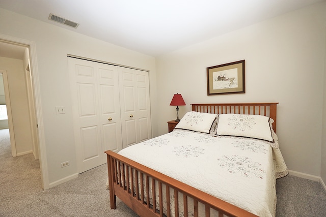 carpeted bedroom with a closet