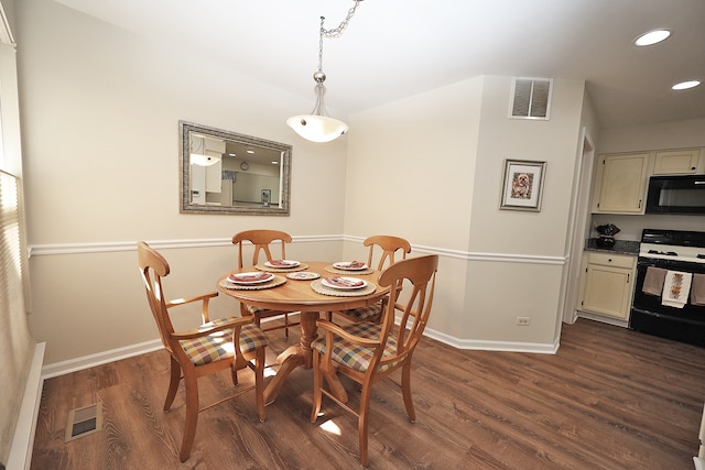 dining area featuring dark hardwood / wood-style flooring