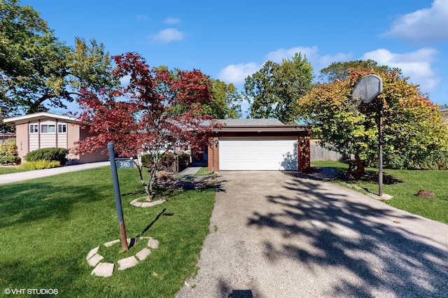 view of front facade featuring a garage and a front lawn