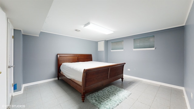 bedroom featuring crown molding